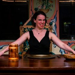 Minneapolis theater - a woman sitting at a table
